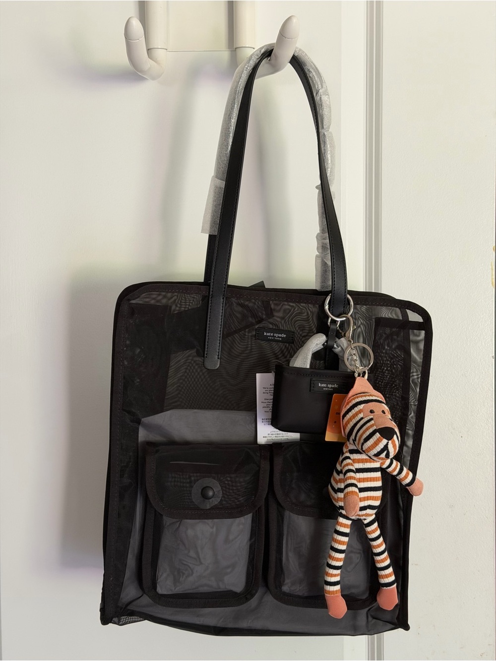 kate spade black breezy mesh messenger bag with striped plush tiger charm nwt